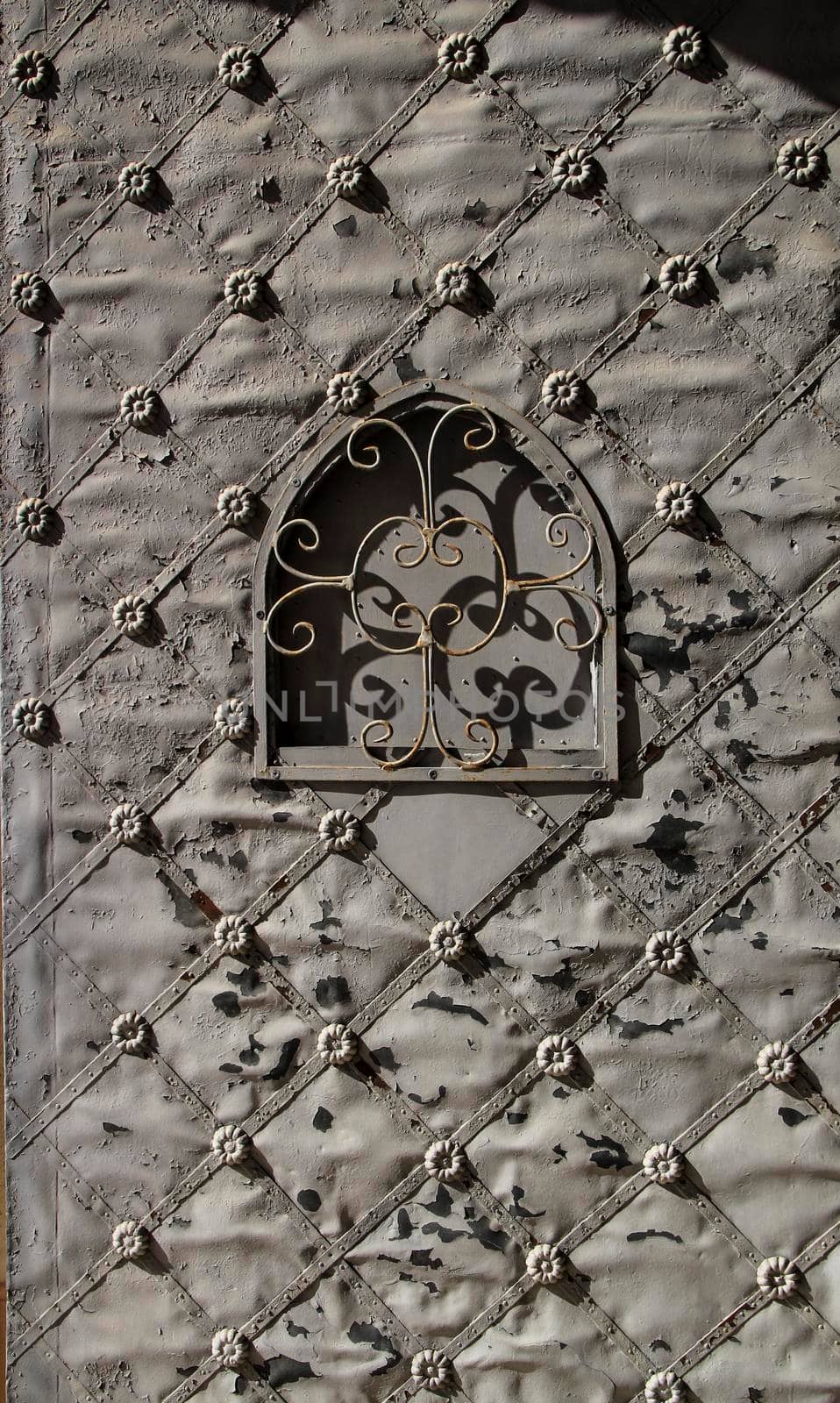 Old forged gray metal door in Spain by soniabonet