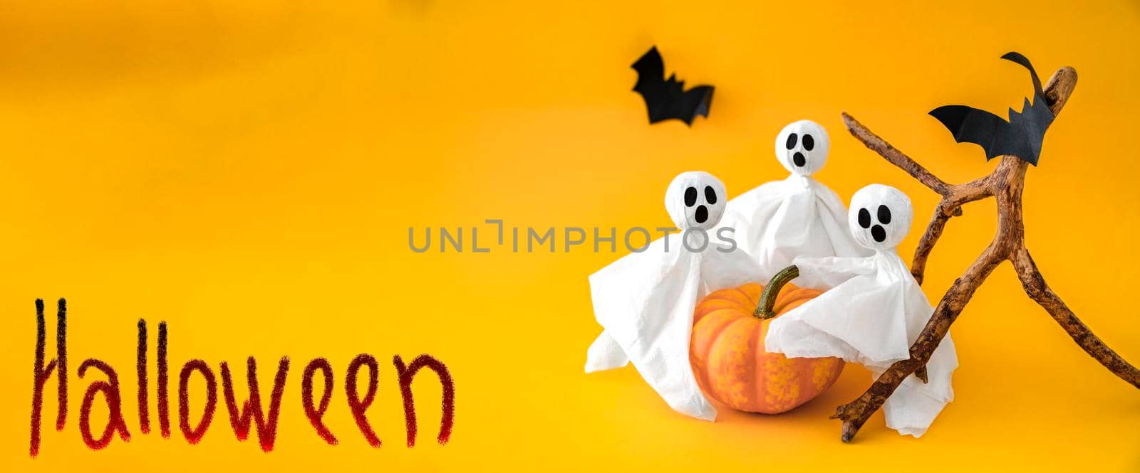 Pumpkin, gosts and bats on orange background with inscription Halloween. Banner, copy space