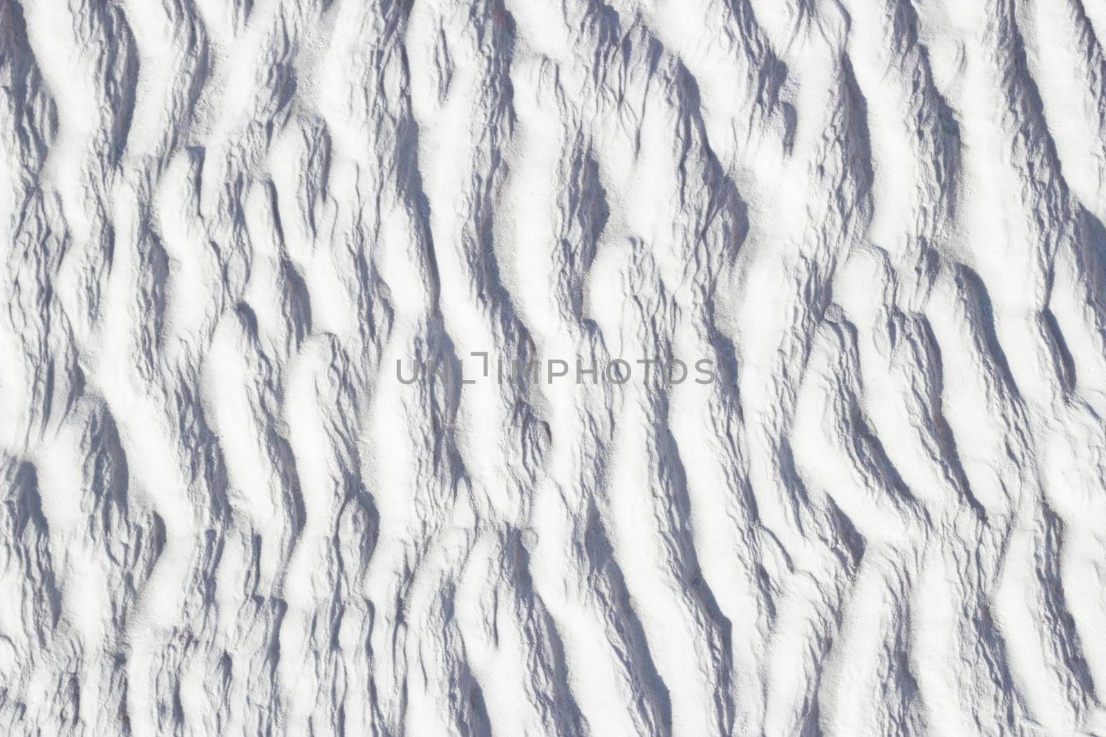White texture of Pamukkale calcium travertine, pattern of vertical waves by Laguna781