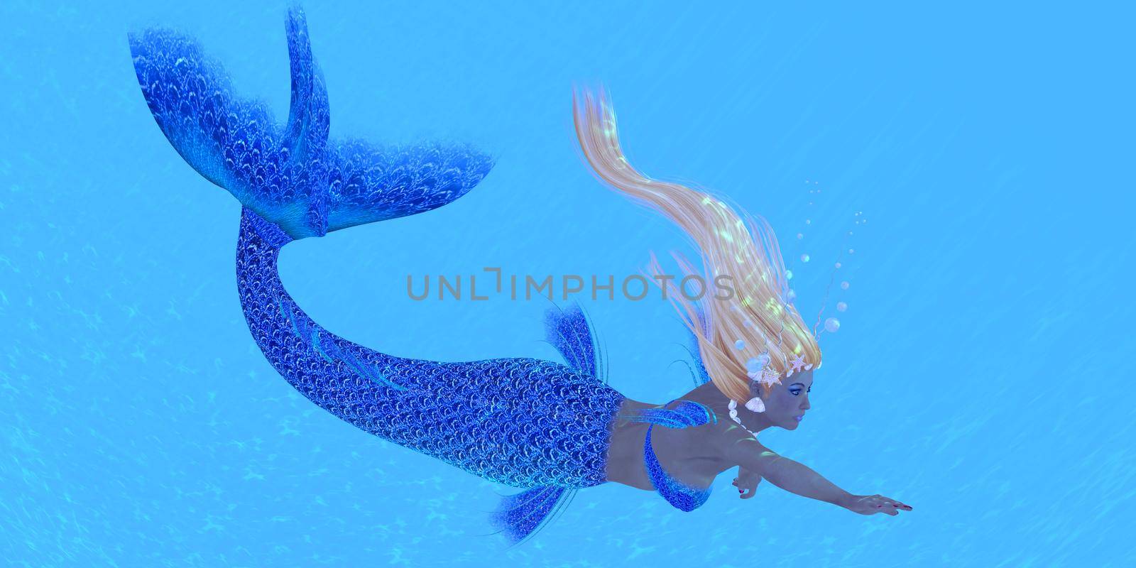 A beautiful blue mermaid swims in clear tropical waters.