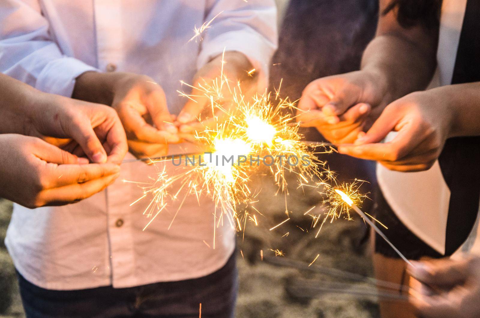Beautiful sparklers in people hands ,holiday and xmas and new year concept.