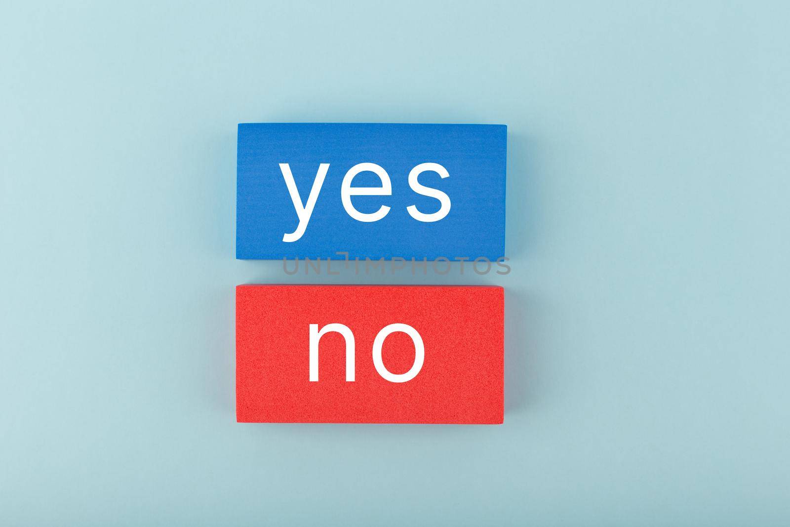 Yes and no written on blue and red rectangles. Concept of positive and negative answer, checklist, questionnaire