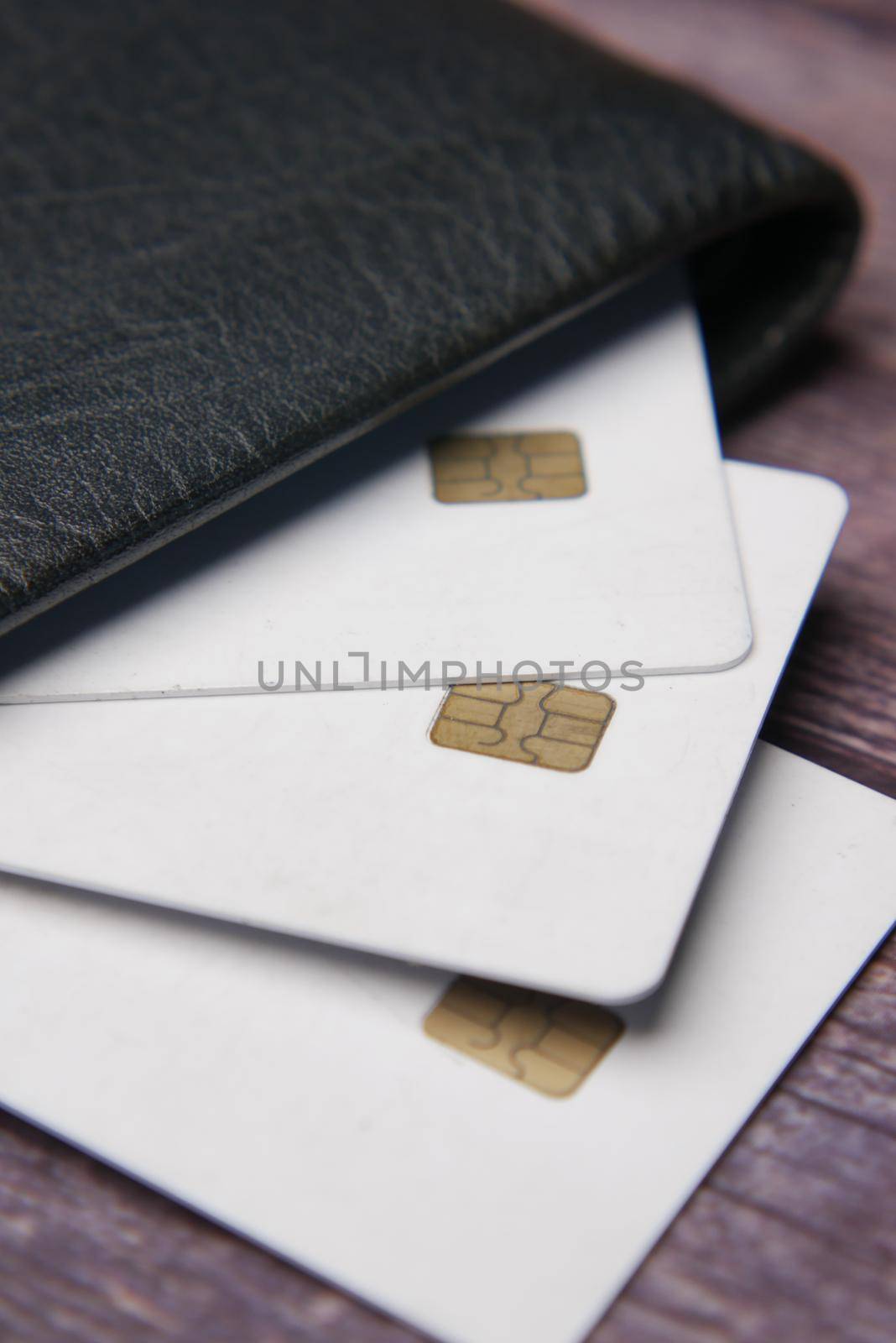 close up of credit cards in a wallet on wooden background ,