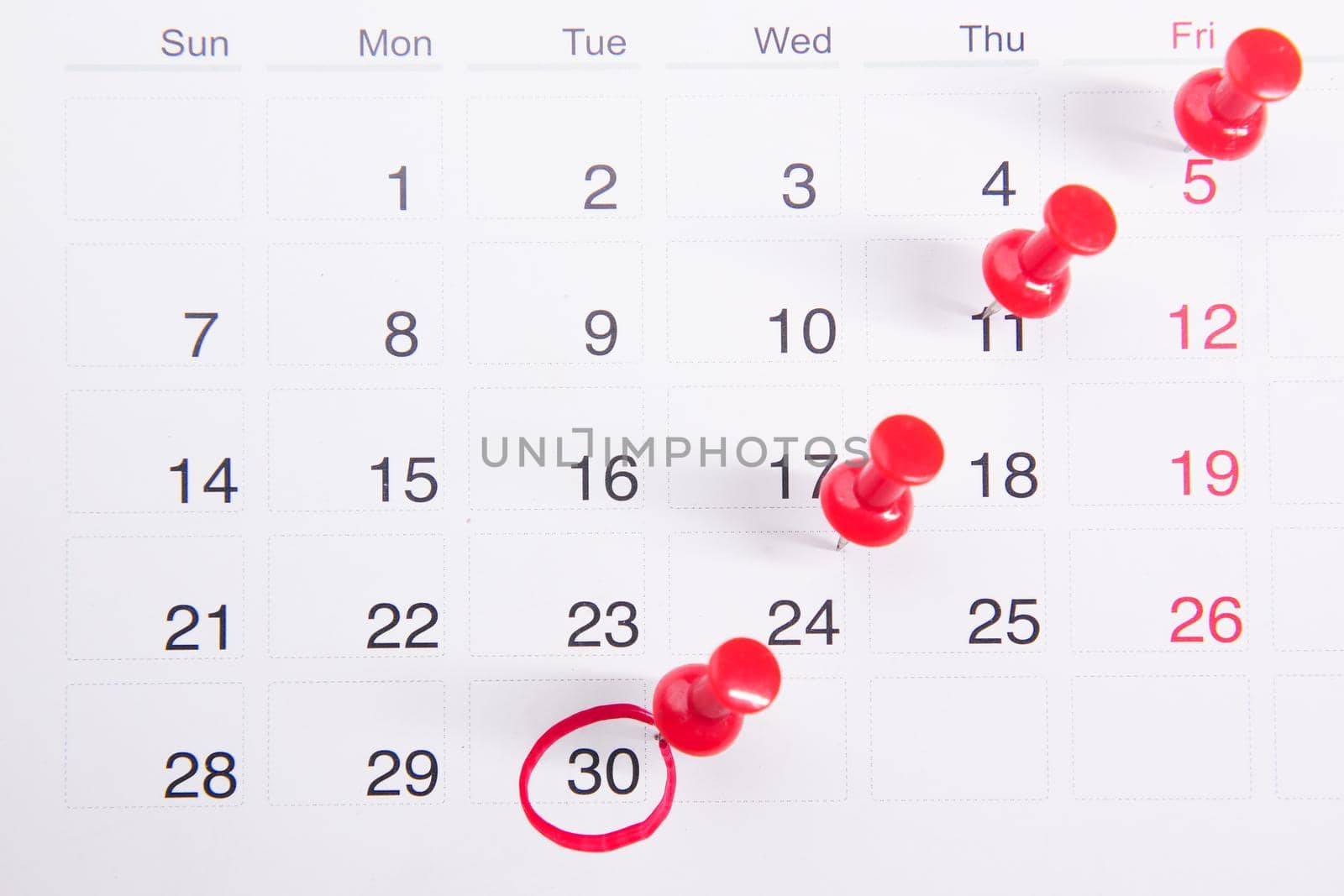 deadline concept with push pin on calendar date close up .
