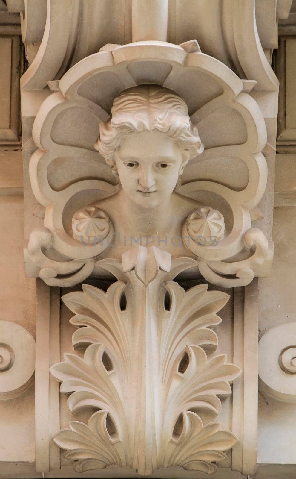 Novelda, Alicante, Spain- September 18, 2021: Carved stone woman face on the facade of the Modernist House Museum in Novelda