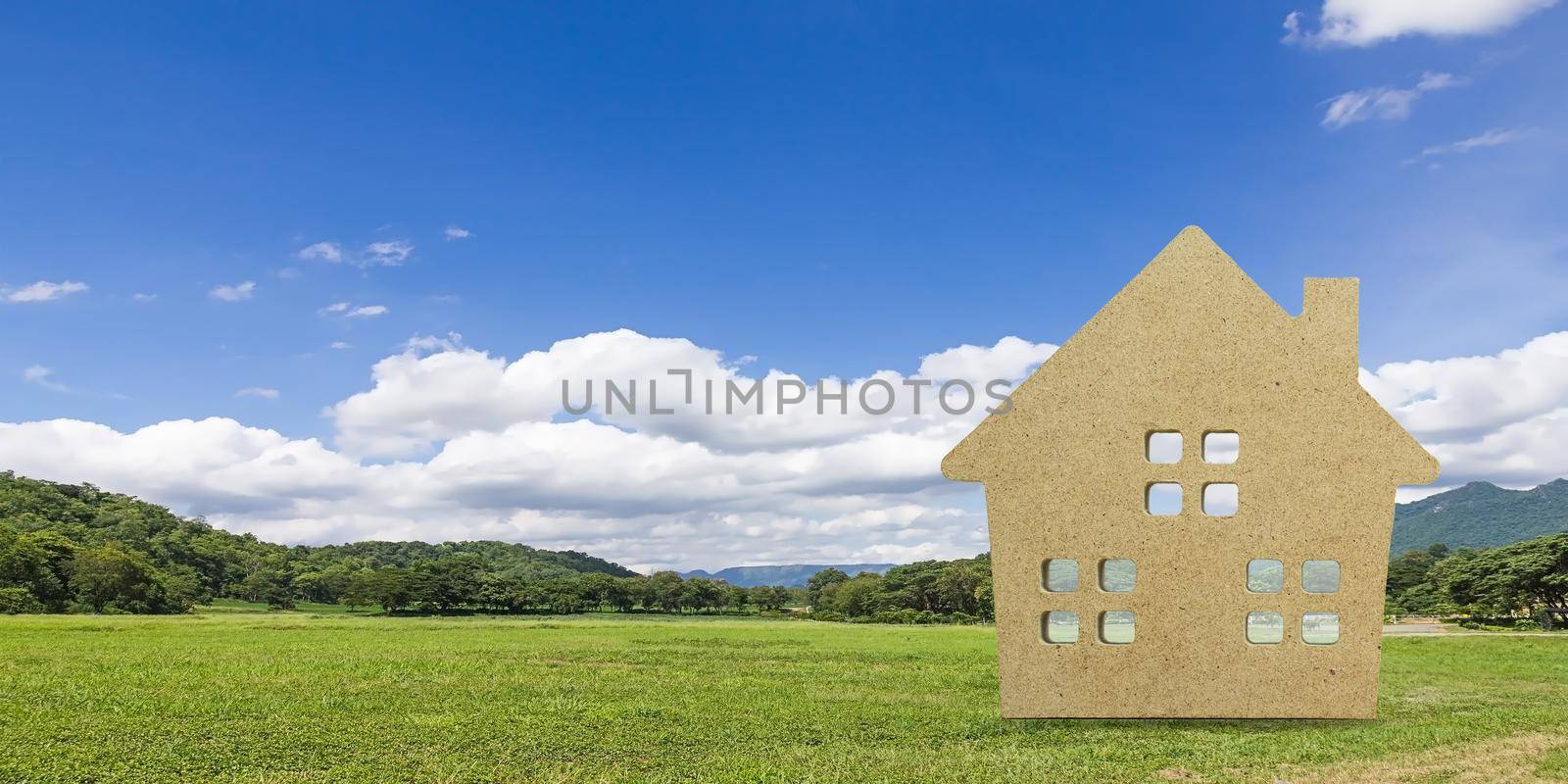 House model with landscape back background for finance and banking concept