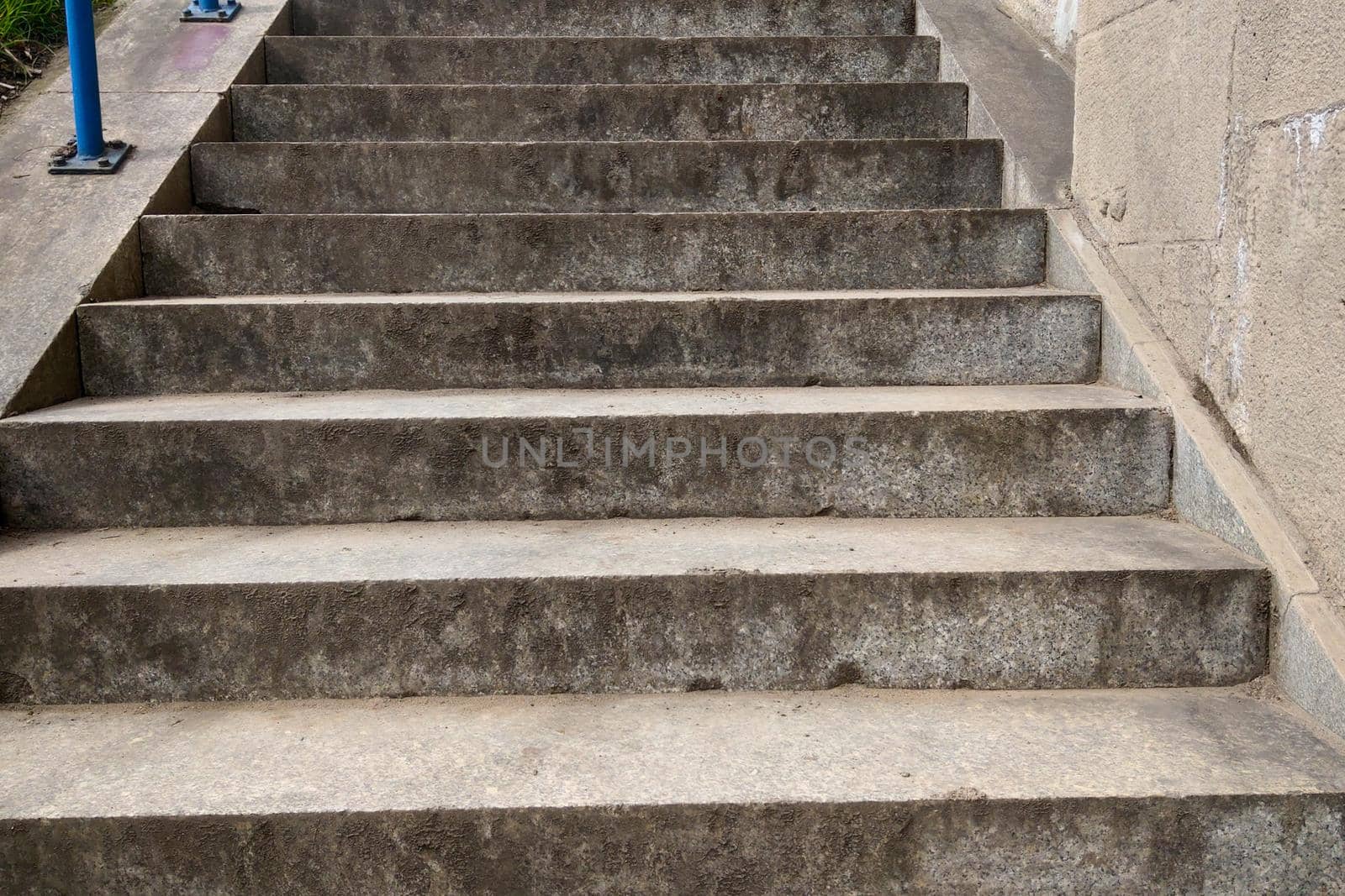 View from below on the gray staircase in the city