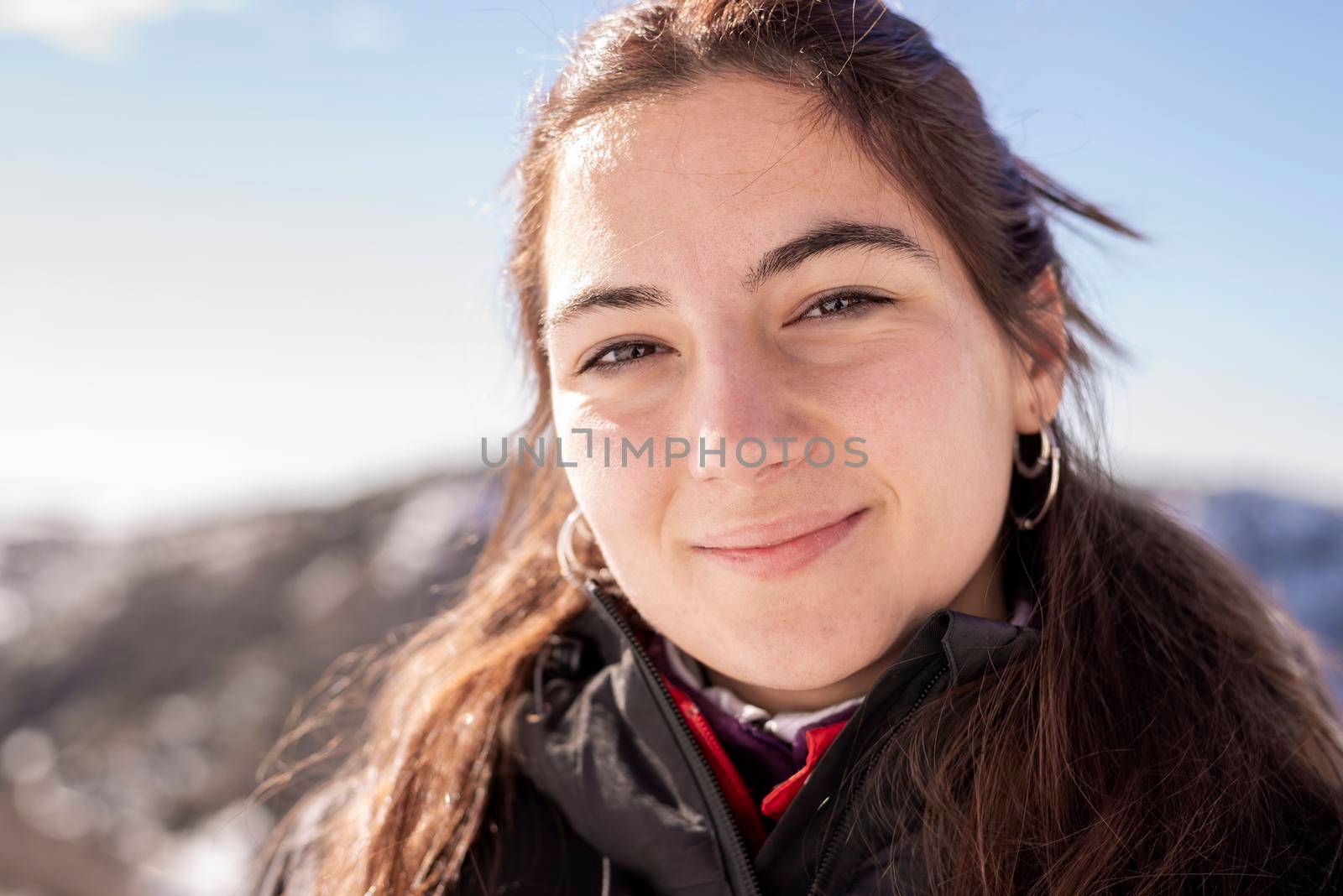 Portrait of smiling young hispanic woman outdoor by raferto1973