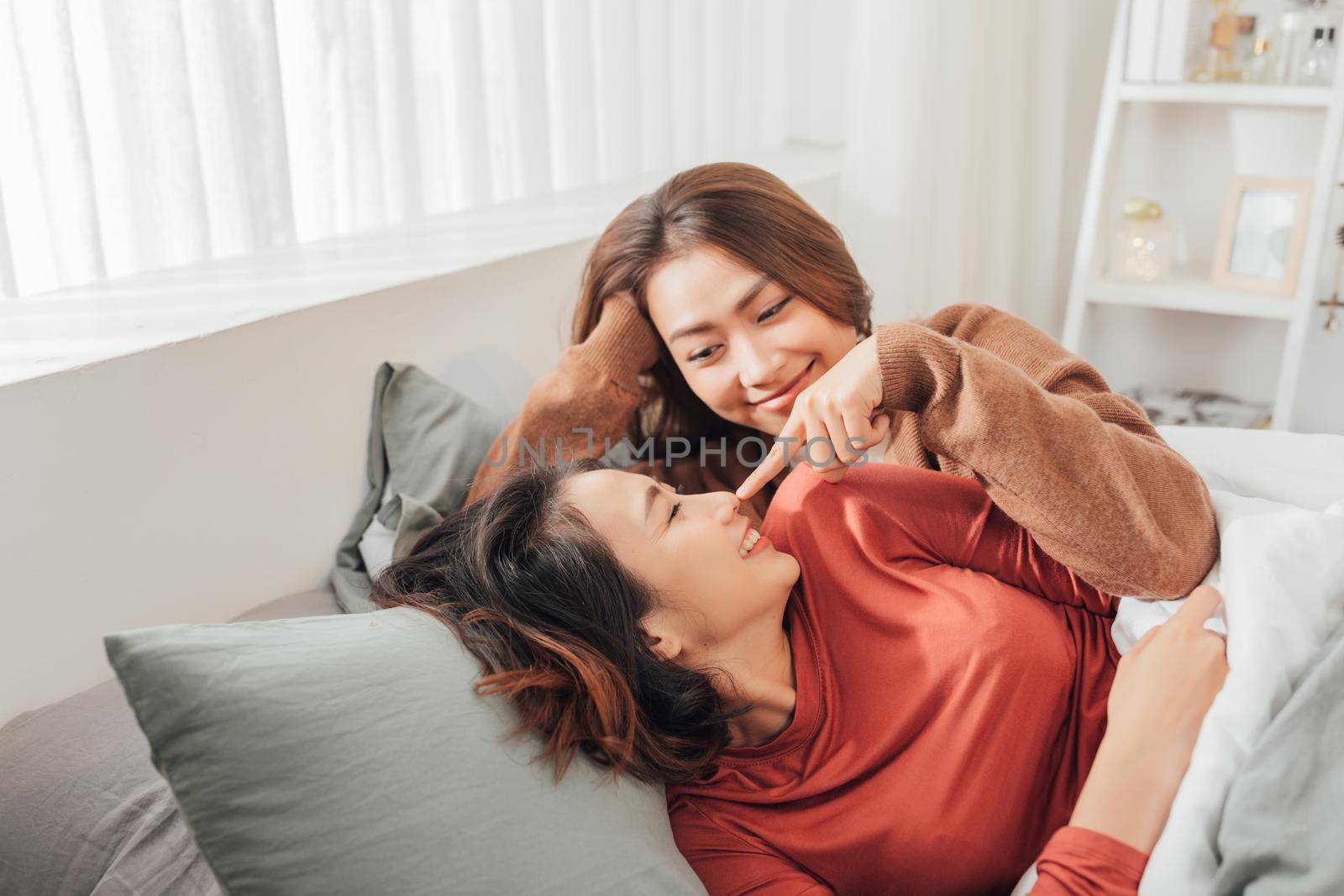 Happy Same sex asian lesbian couple lover at the bedroom by makidotvn