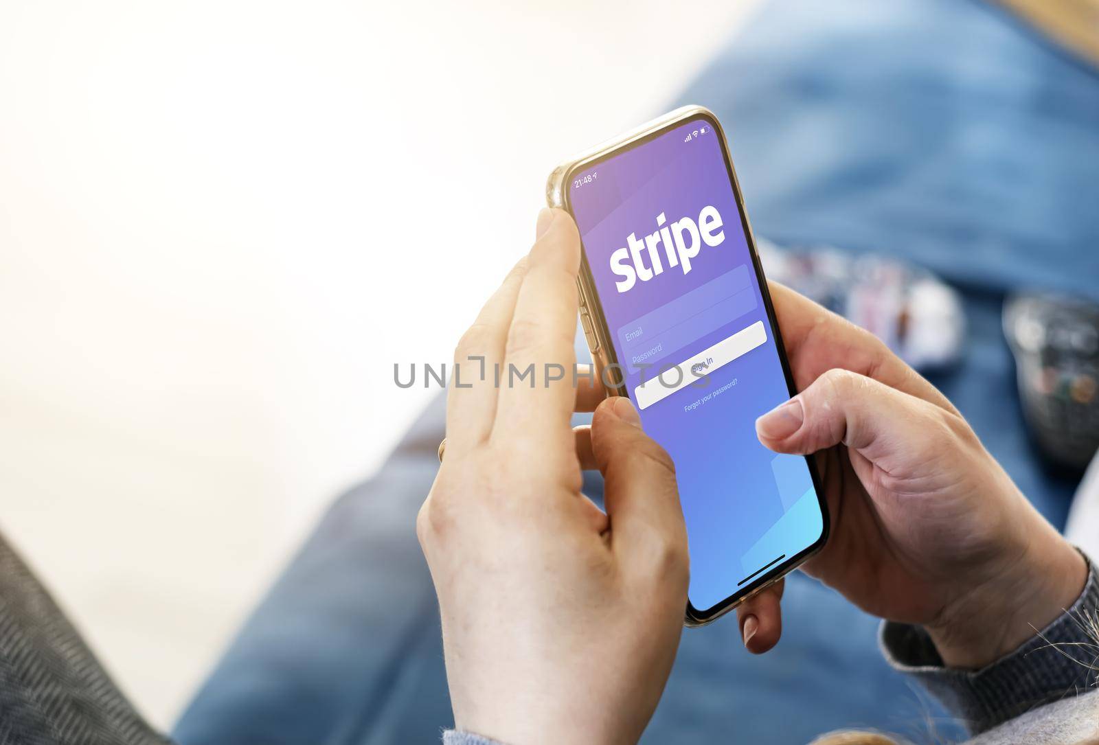 San Francisco, CA, USA, March 15, 2021: Woman holding a smart phone with Stripe app on the screen. Stripe is an American financial services company. Business and finance