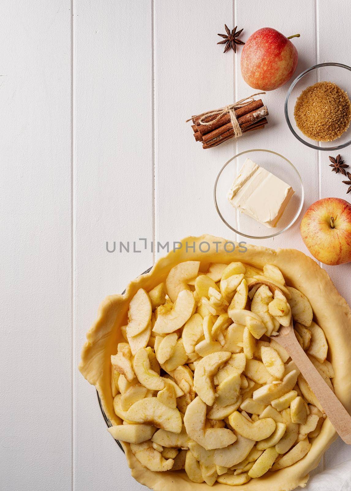 Cooking of homemade apple pie on wooden table by Desperada