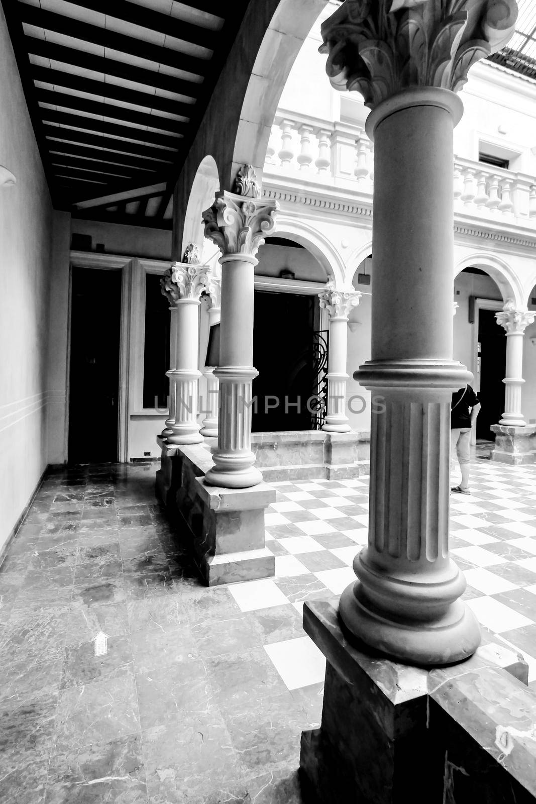 Courtyard with skylight and marble columns at Gomez-Tortosa Center by soniabonet