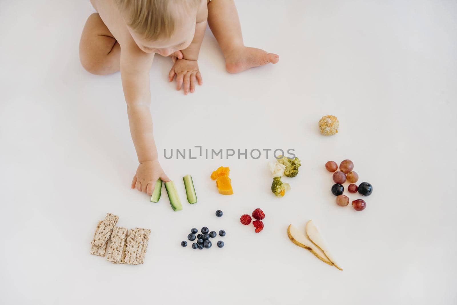 high angle baby choosing what eat alone. High quality beautiful photo concept by Zahard