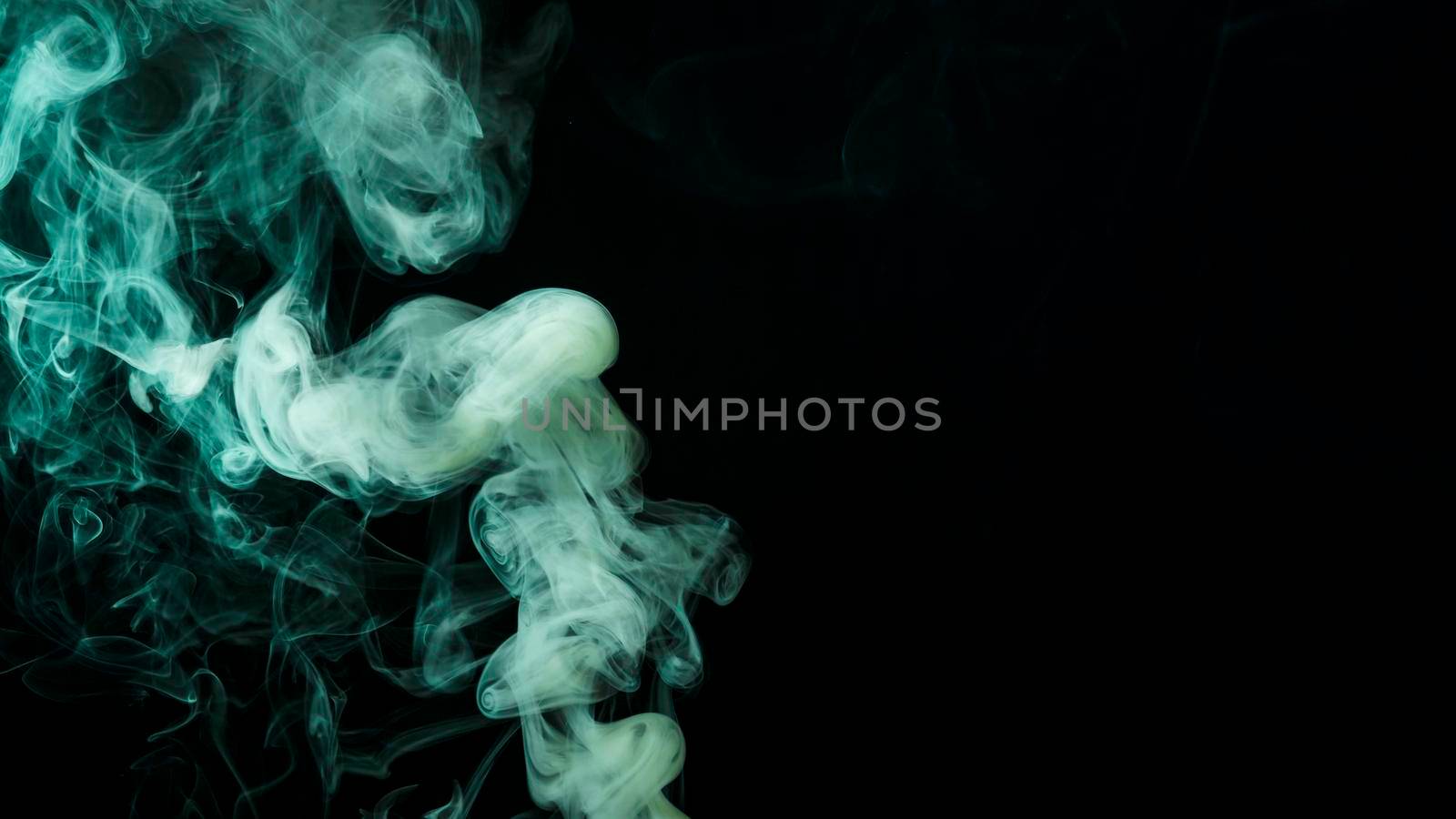 abstract green smoke move black background. Beautiful photo