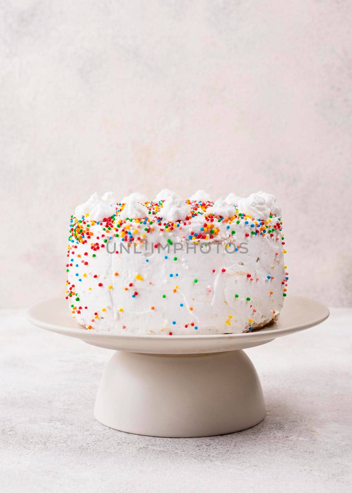 delicious birthday cake with sprinkles. High quality photo by Zahard