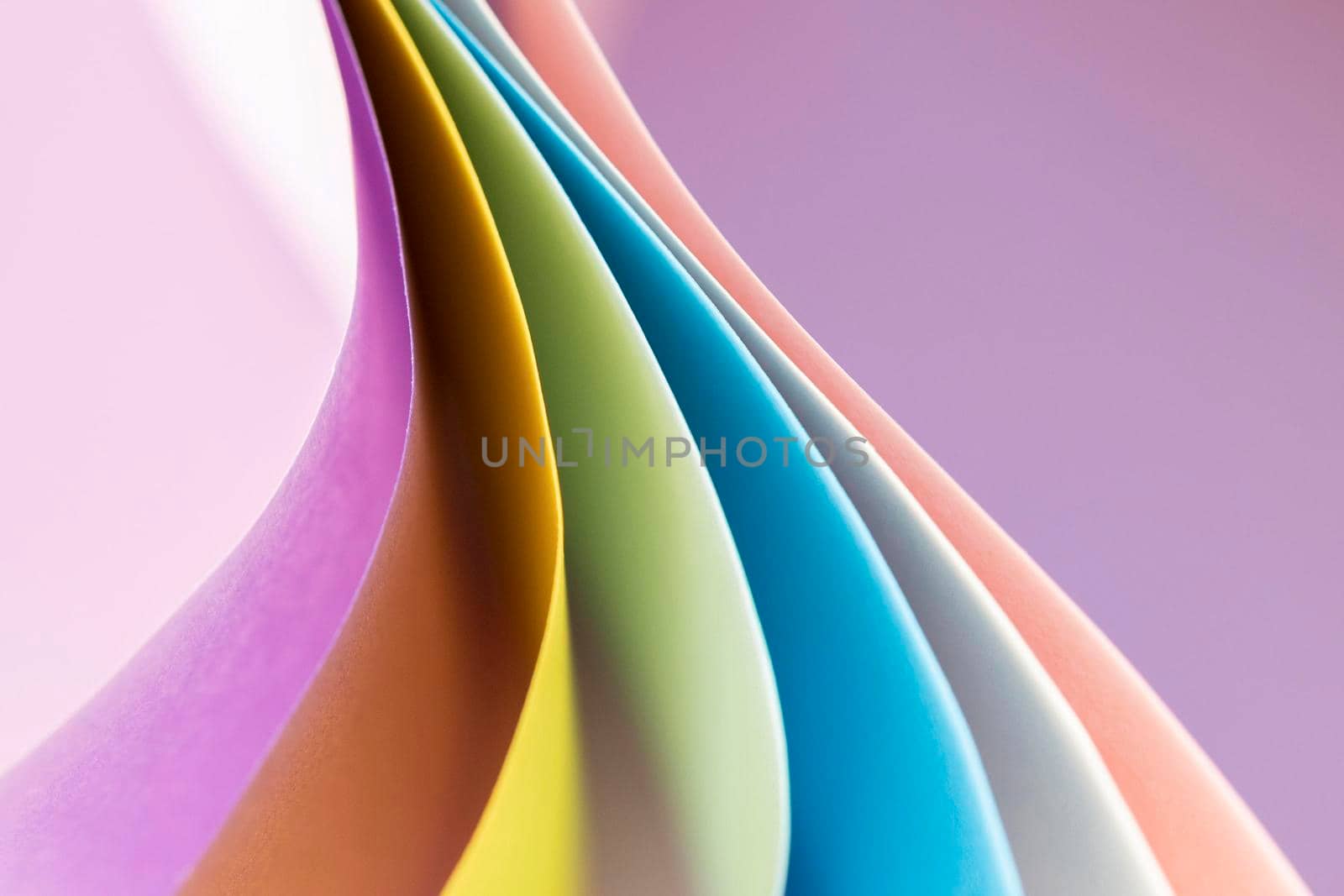 curved layers colored papers empty background. High resolution photo