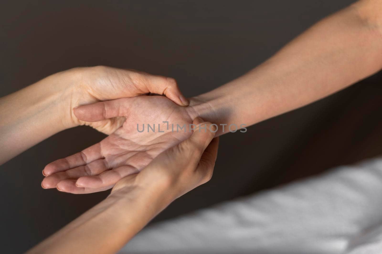 close up hands massaging wrist. Beautiful photo