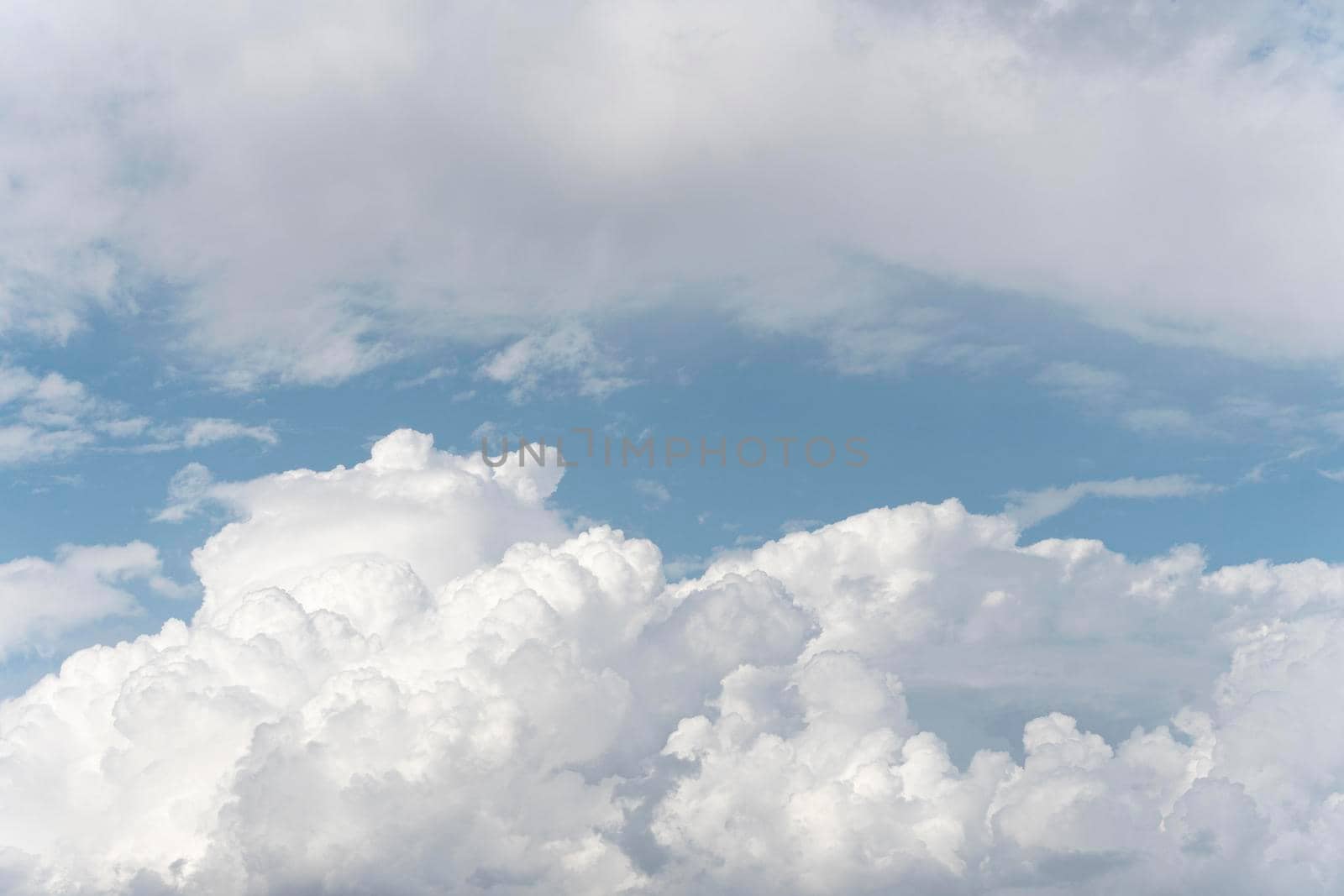 fluffy clouds blue sky. High quality photo by Zahard