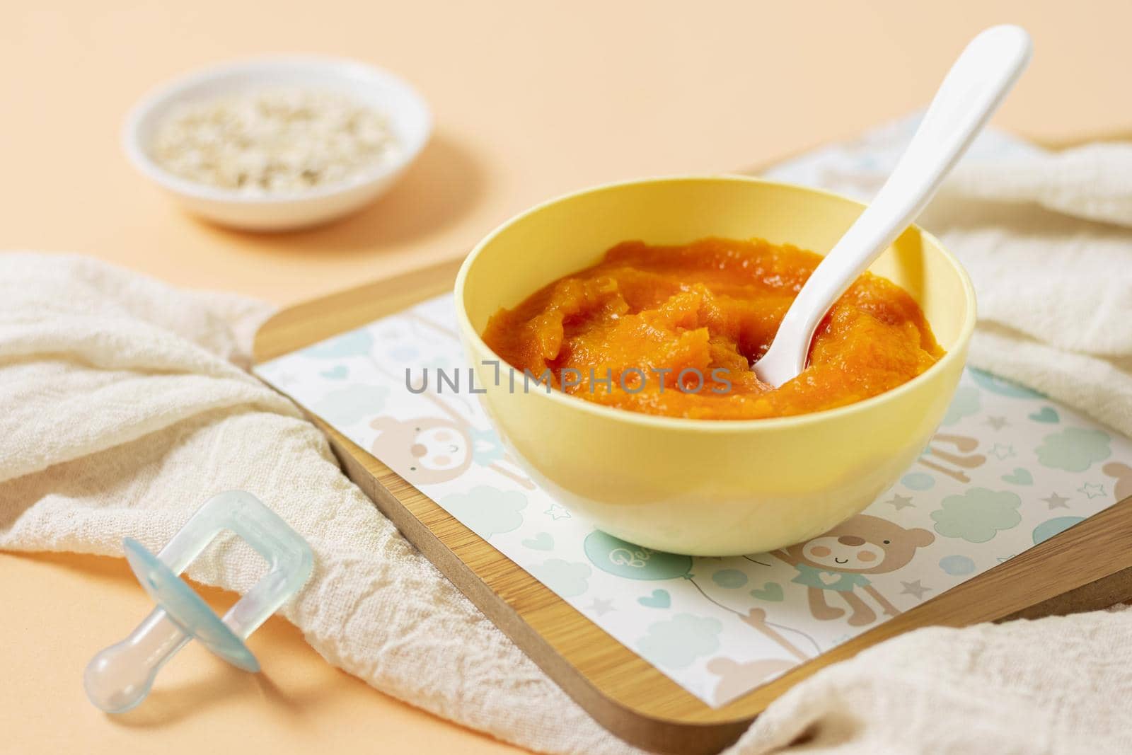 high angle yellow bowl with baby food. Resolution and high quality beautiful photo