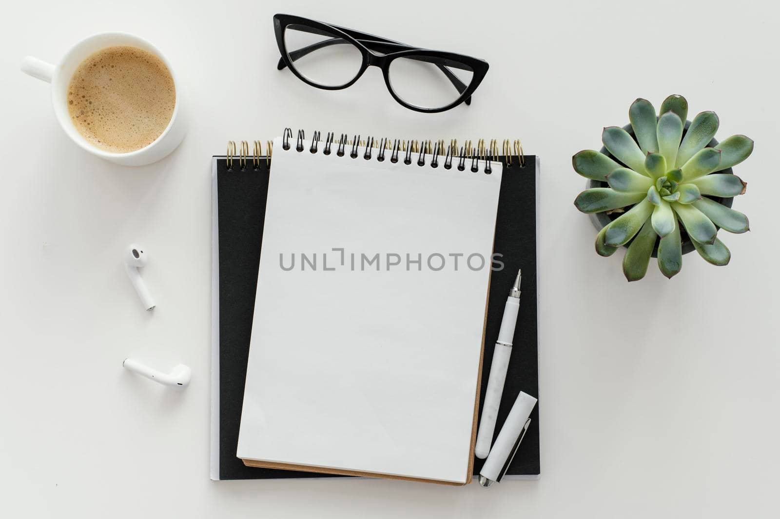 arrangement with empty notepad desk. Beautiful photo