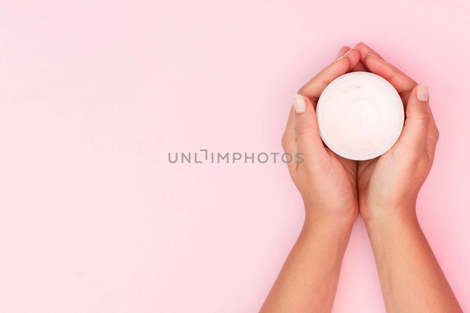 woman holding face cream box with copy space. High quality photo by Zahard