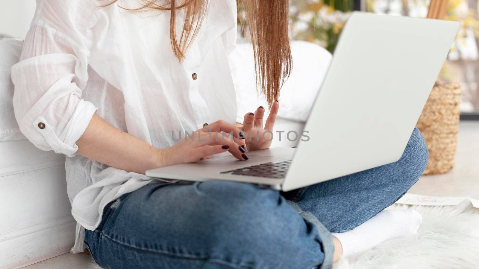 woman working with her laptop her lap. High resolution photo