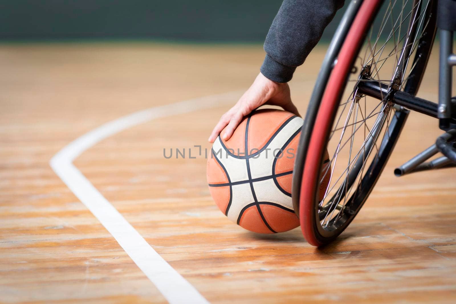 close up hand holding basketball by Zahard