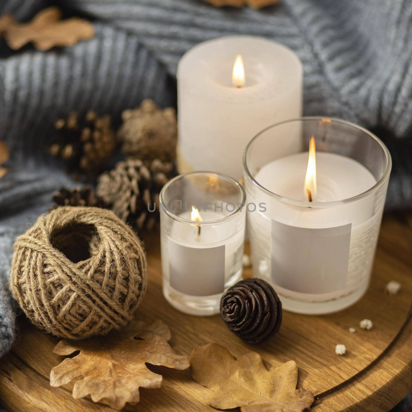 high angle lit candles with string pine cones. High quality beautiful photo concept by Zahard