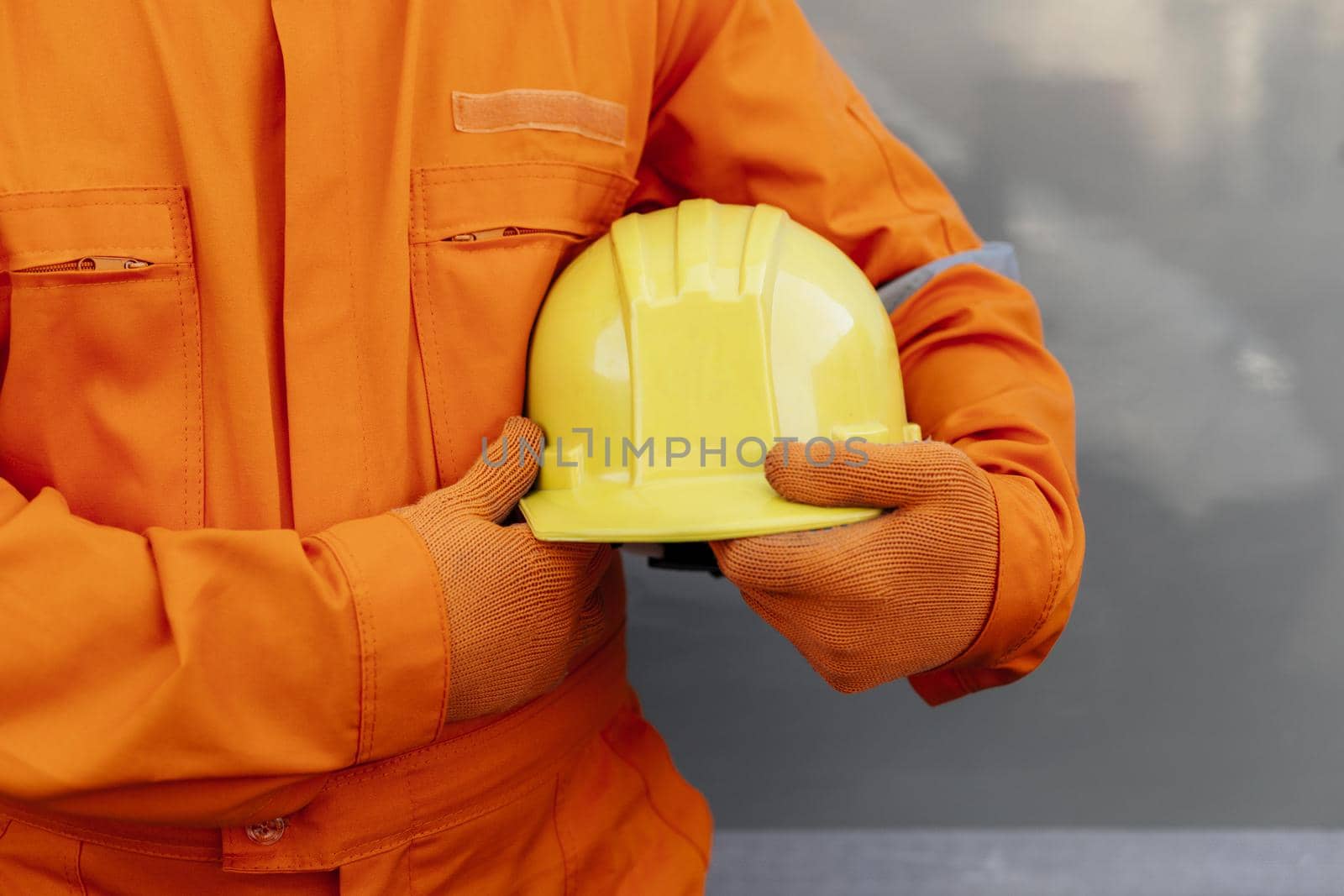 front view worker uniform holding hard hat 2. Resolution and high quality beautiful photo