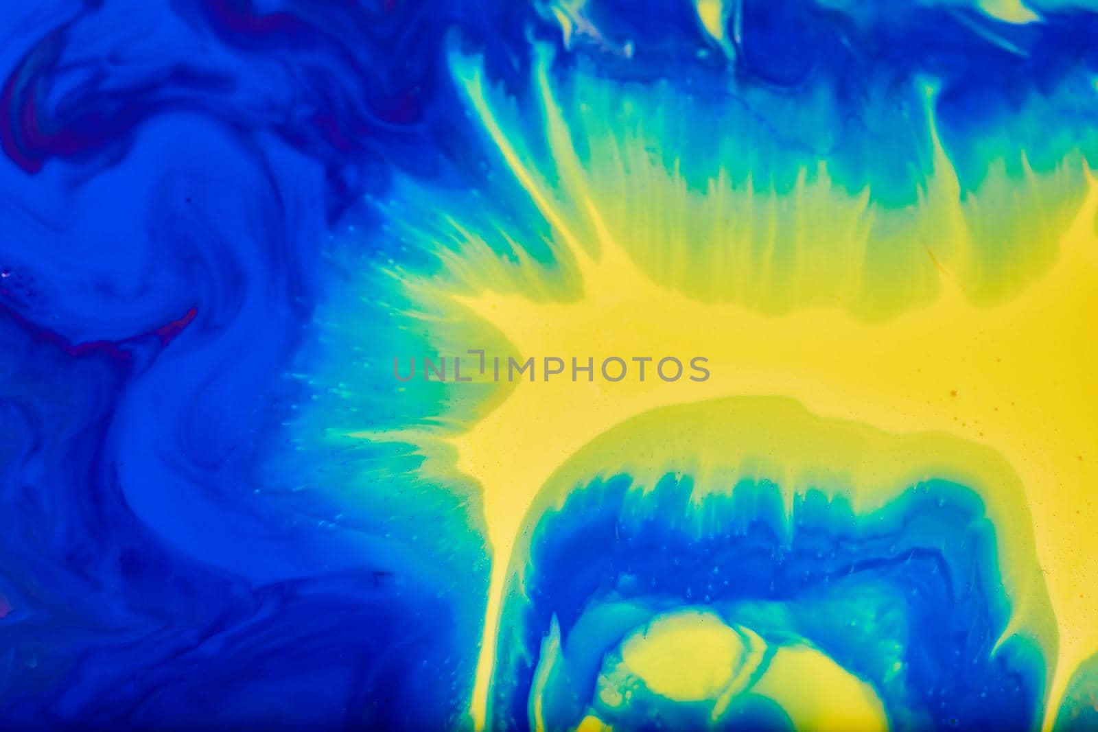 Bold and colorful swirls of blue and yellow merging into green by njproductions