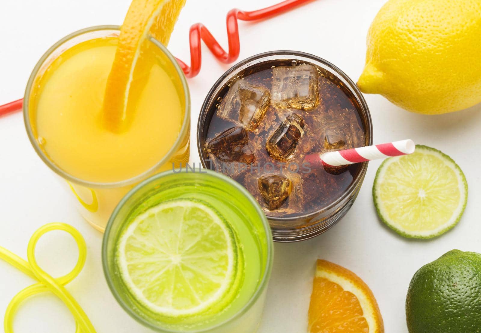 high angle glasses with soft drink fruit juice with straws. High quality beautiful photo concept by Zahard