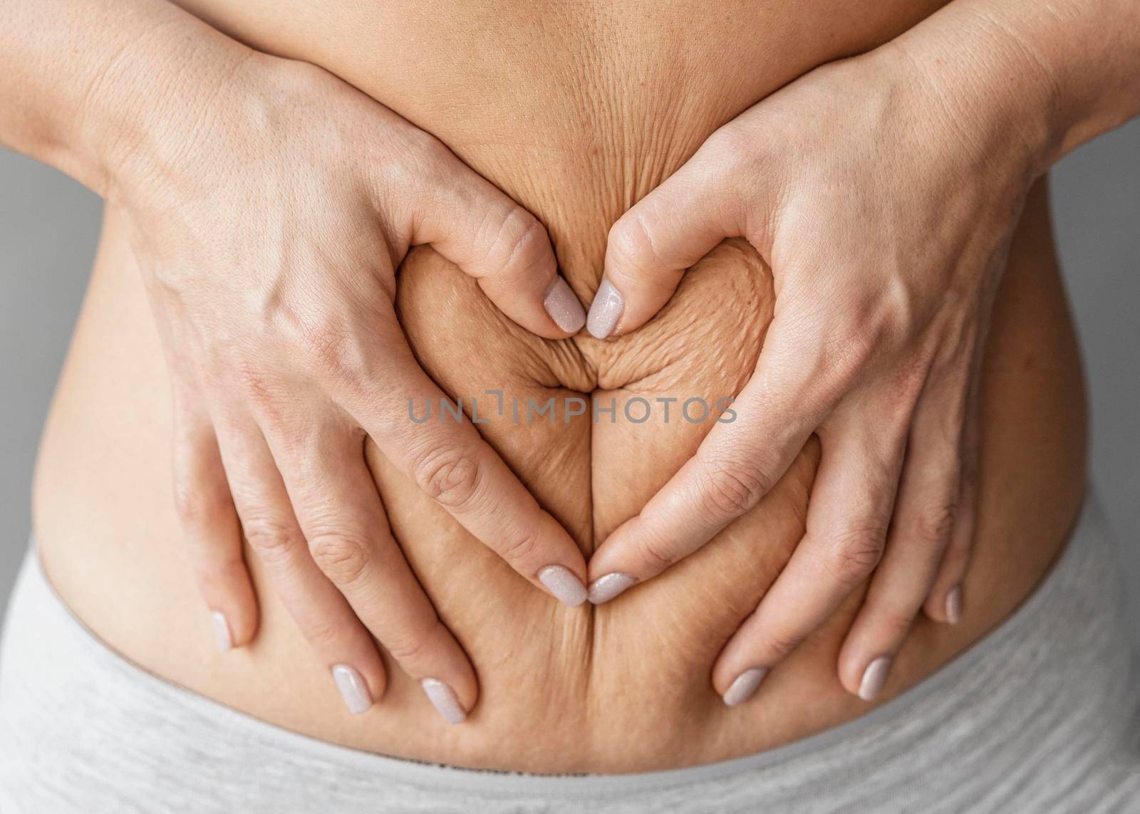 close up hands holding belly. Beautiful photo