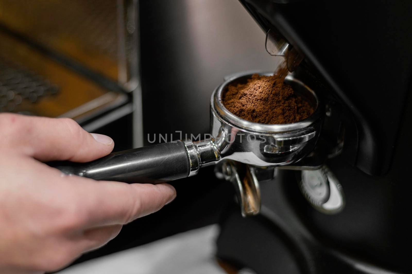 close up male barista using professional coffee machine. Beautiful photo