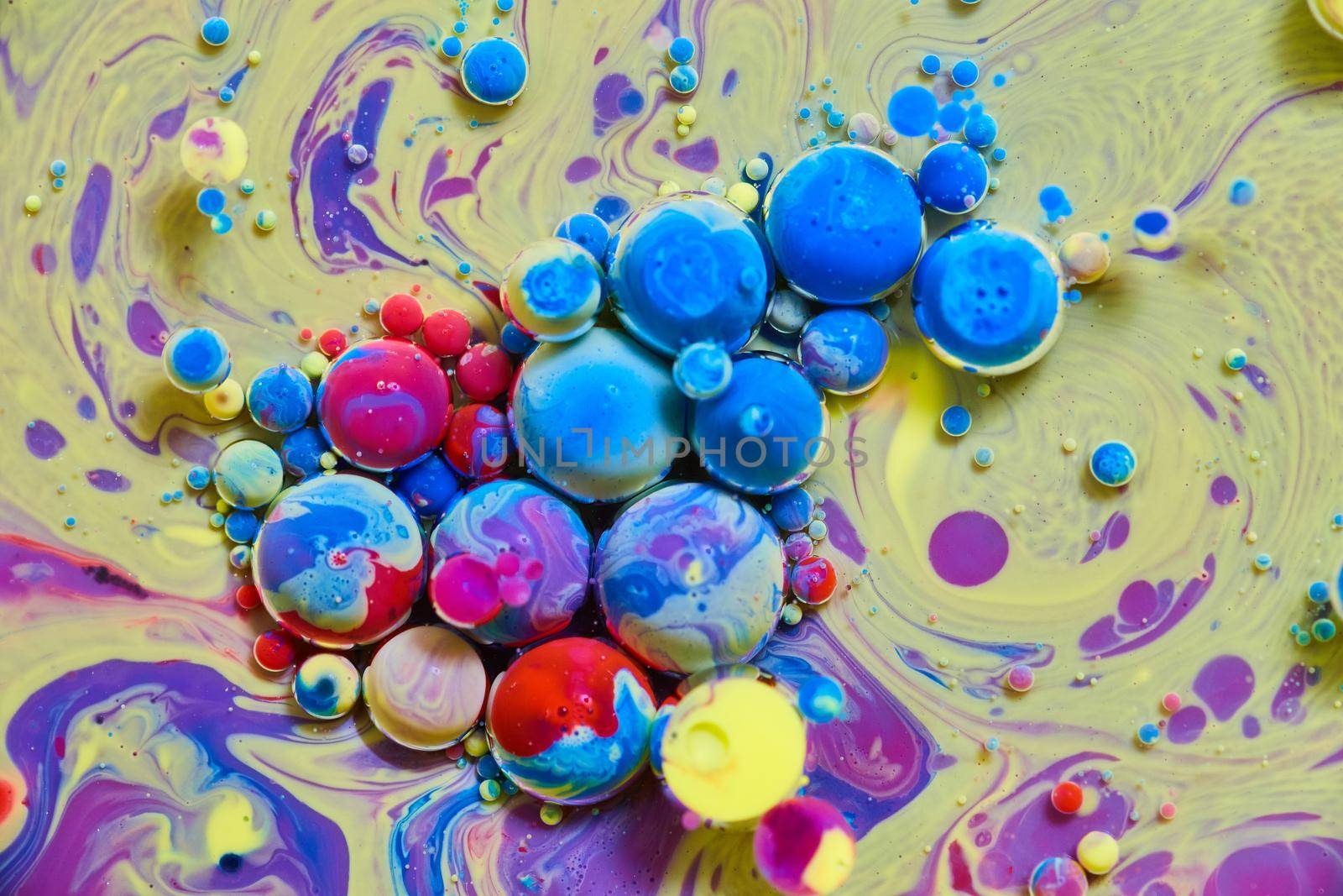Image of Rainbow spheres on yellow and purple silky surface