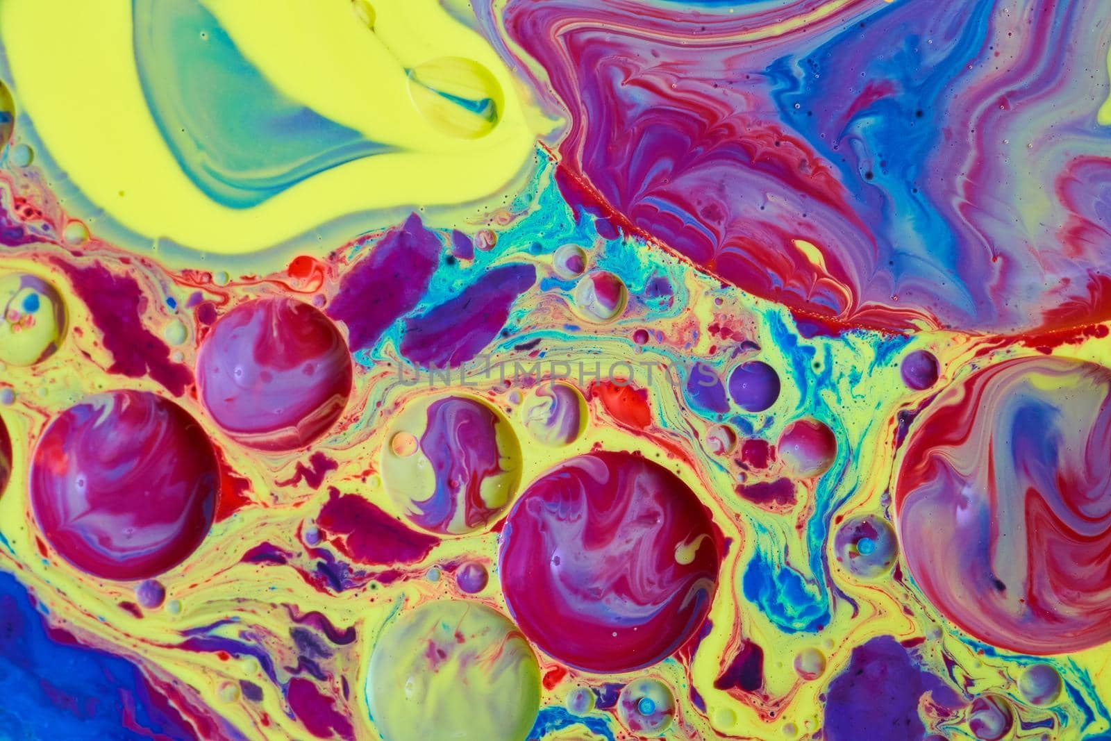 Mystical rainbow surface of liquid from acrylic and oil by njproductions