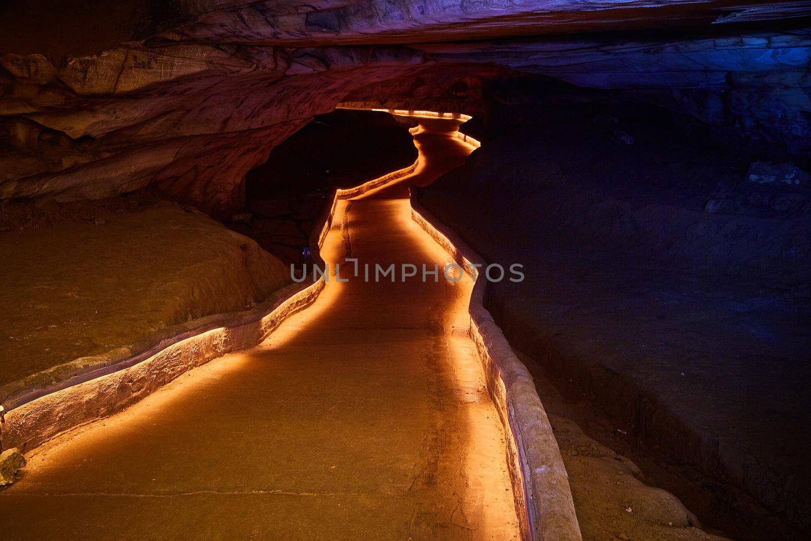 Lite pathway through dark and deep cave by njproductions