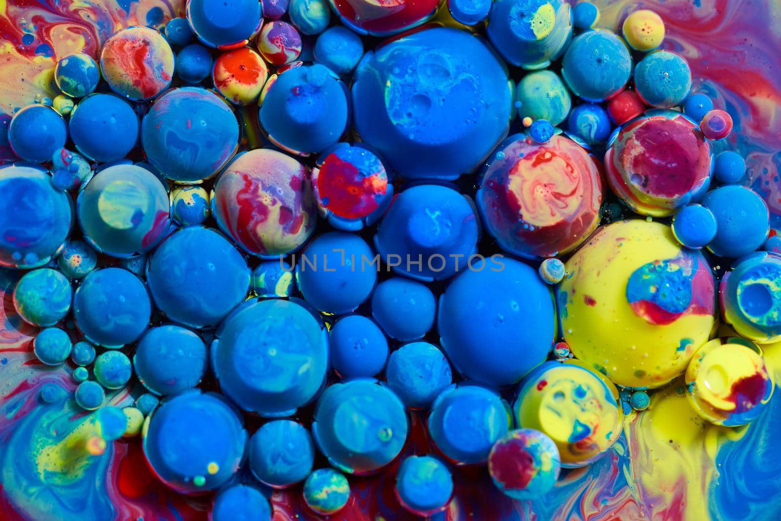 Image of Texture of orbs of acrylic paint floating on surface in cluster