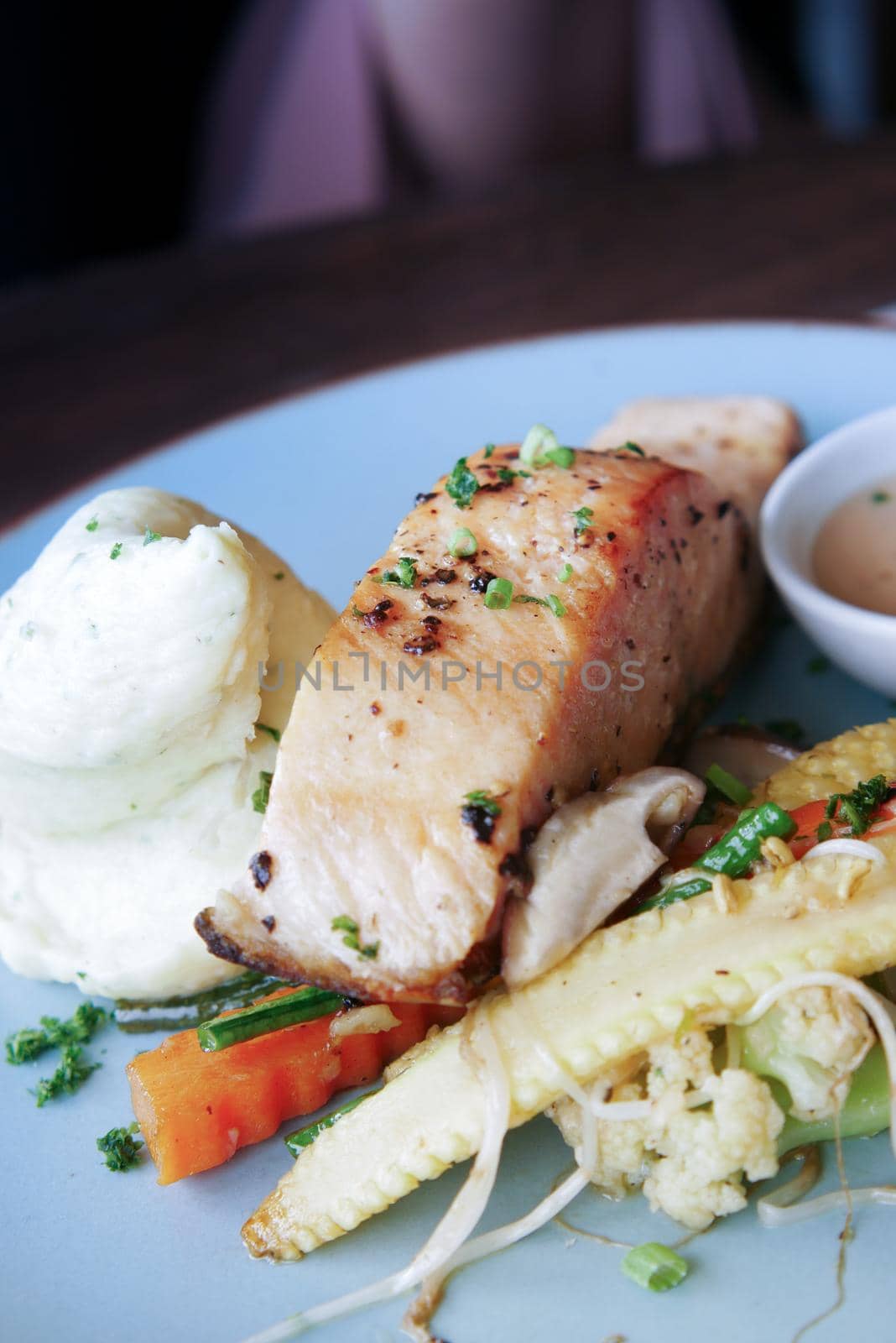 tasty salmon, mash potato and vegetable on plate by towfiq007