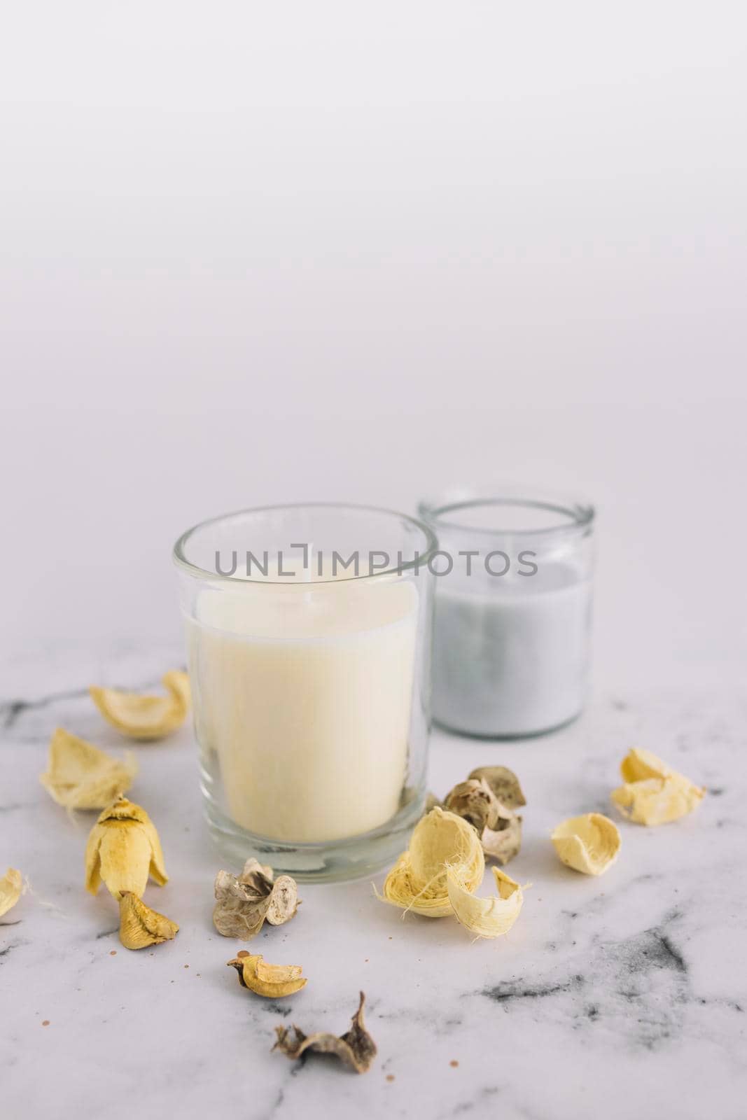 close up dry pods candle candleholder marble surface. Beautiful photo