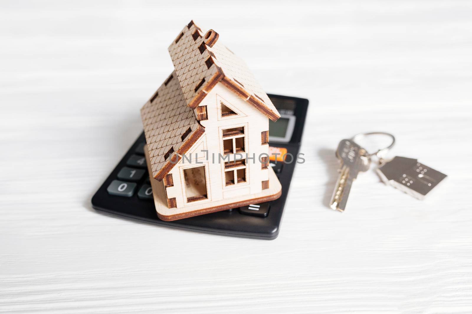 wooden house calculator. High resolution photo