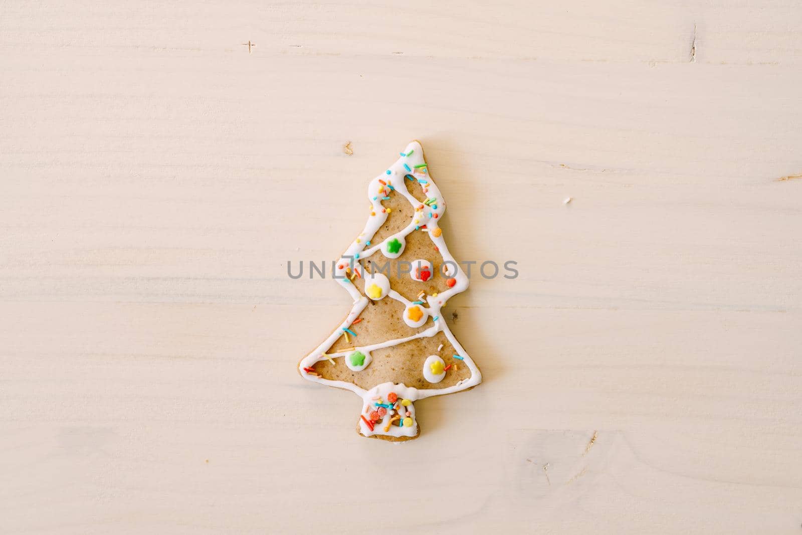 Gingerbread cookies in the shape of a Christmas tree on a white background. High quality photo