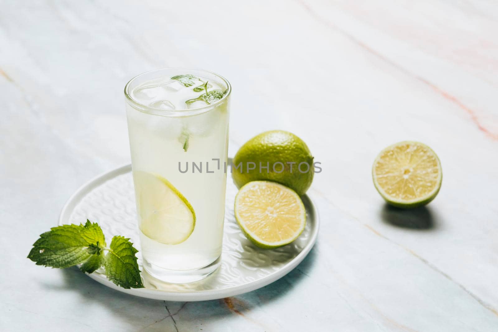 lemonade glass limes bamble background. Beautiful photo