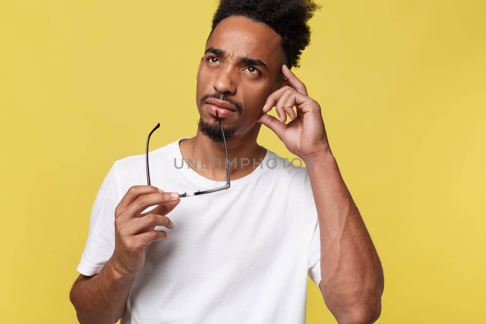 African american business man holding a glass, isolated on yellow background - Black people.