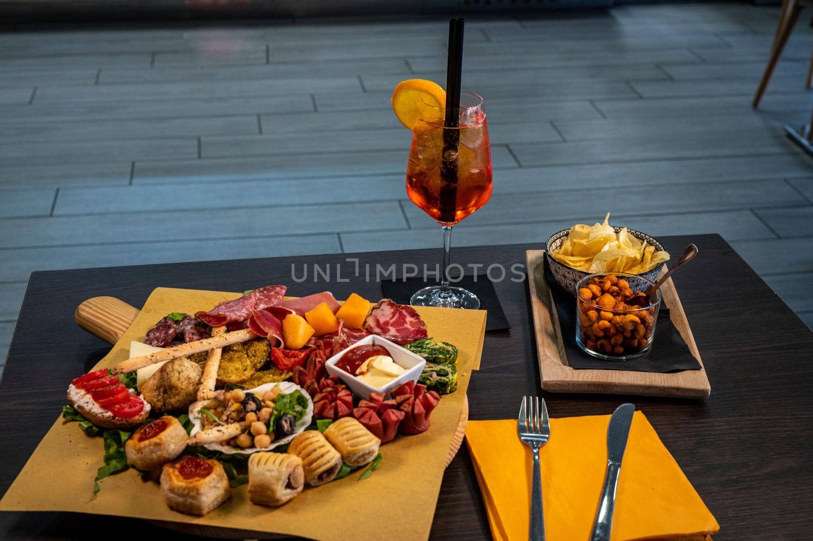 composition of mixed appetizer with coktail on a cutting board