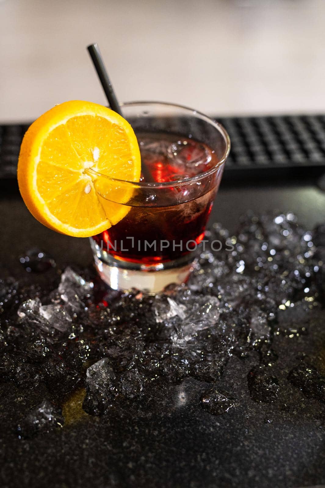 composition of various cocktails on the counter in strong colors and fruit on the head