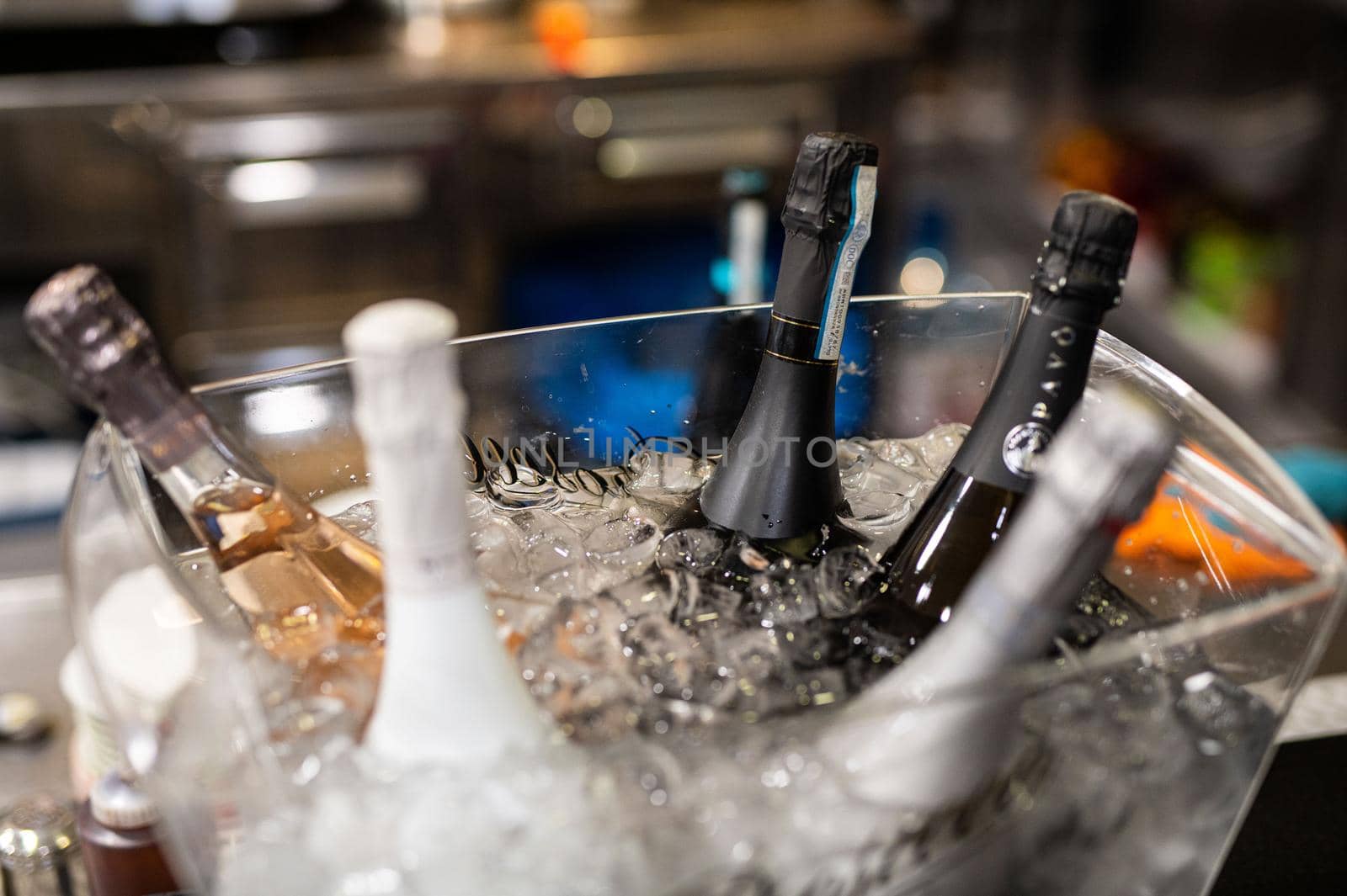 ice bucket with sparkling wine bottles by carfedeph