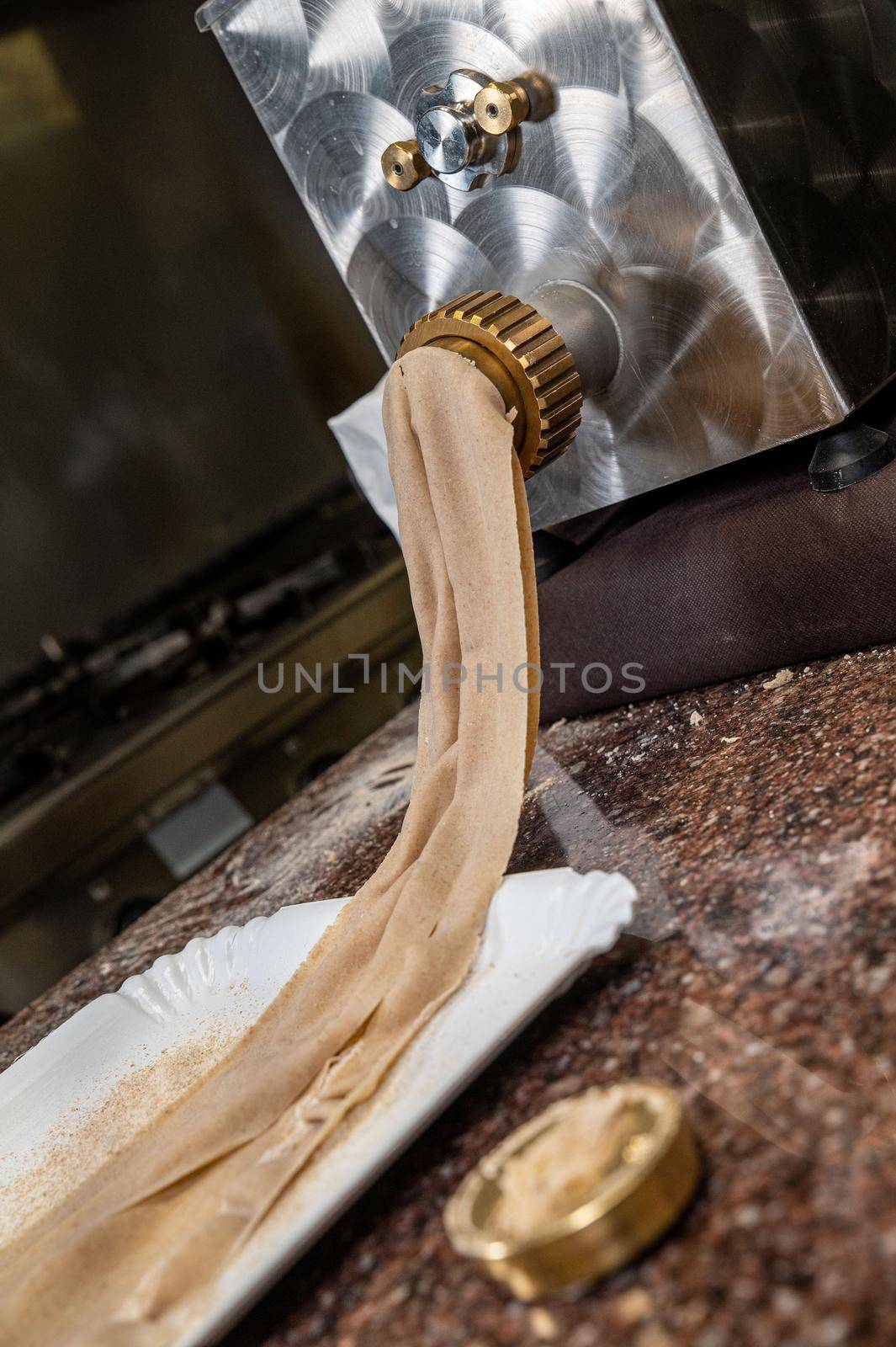 kneading machine while it brings out puff pastry for lasagna