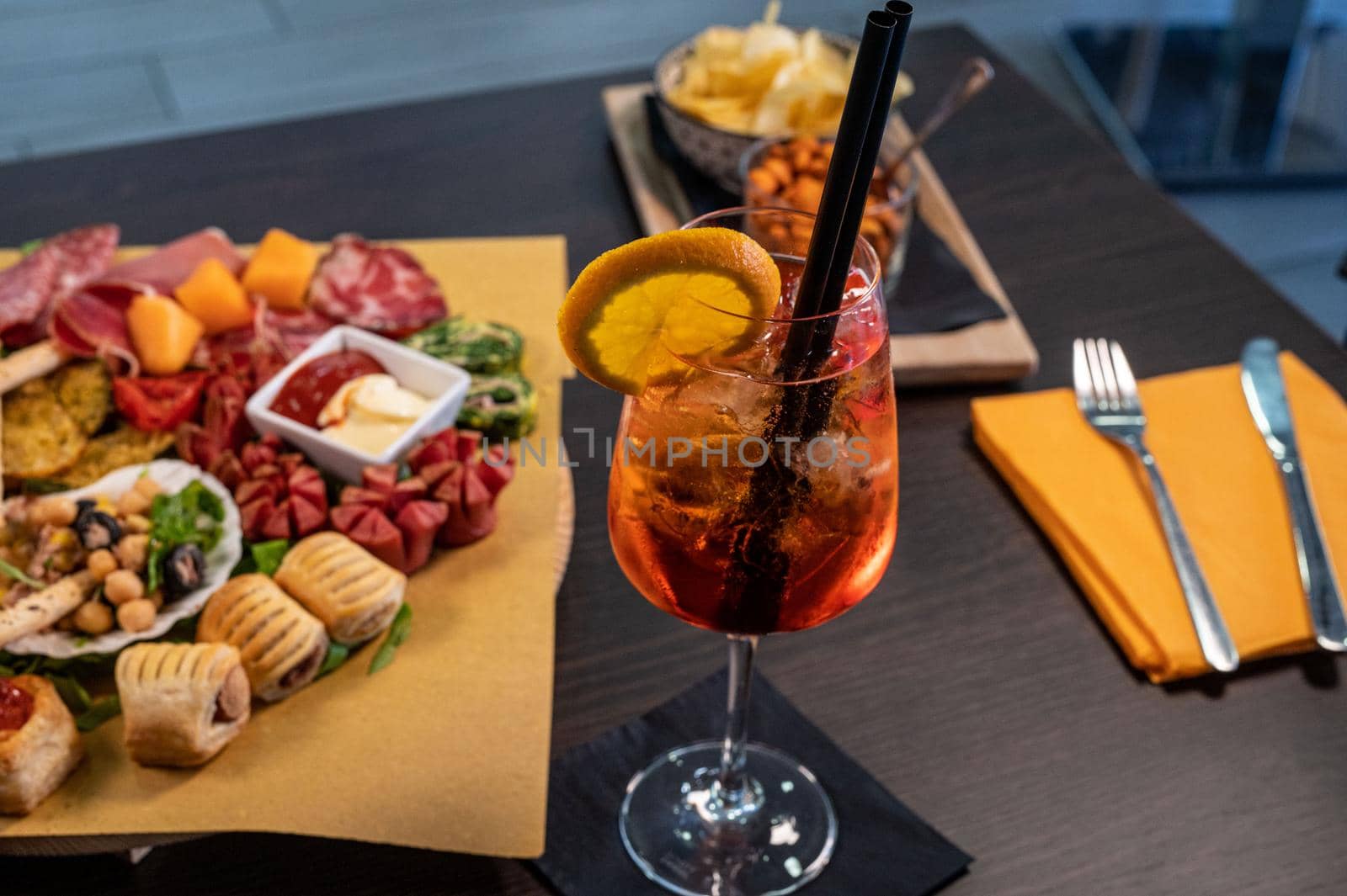 composition of mixed appetizer with coktail on a cutting board