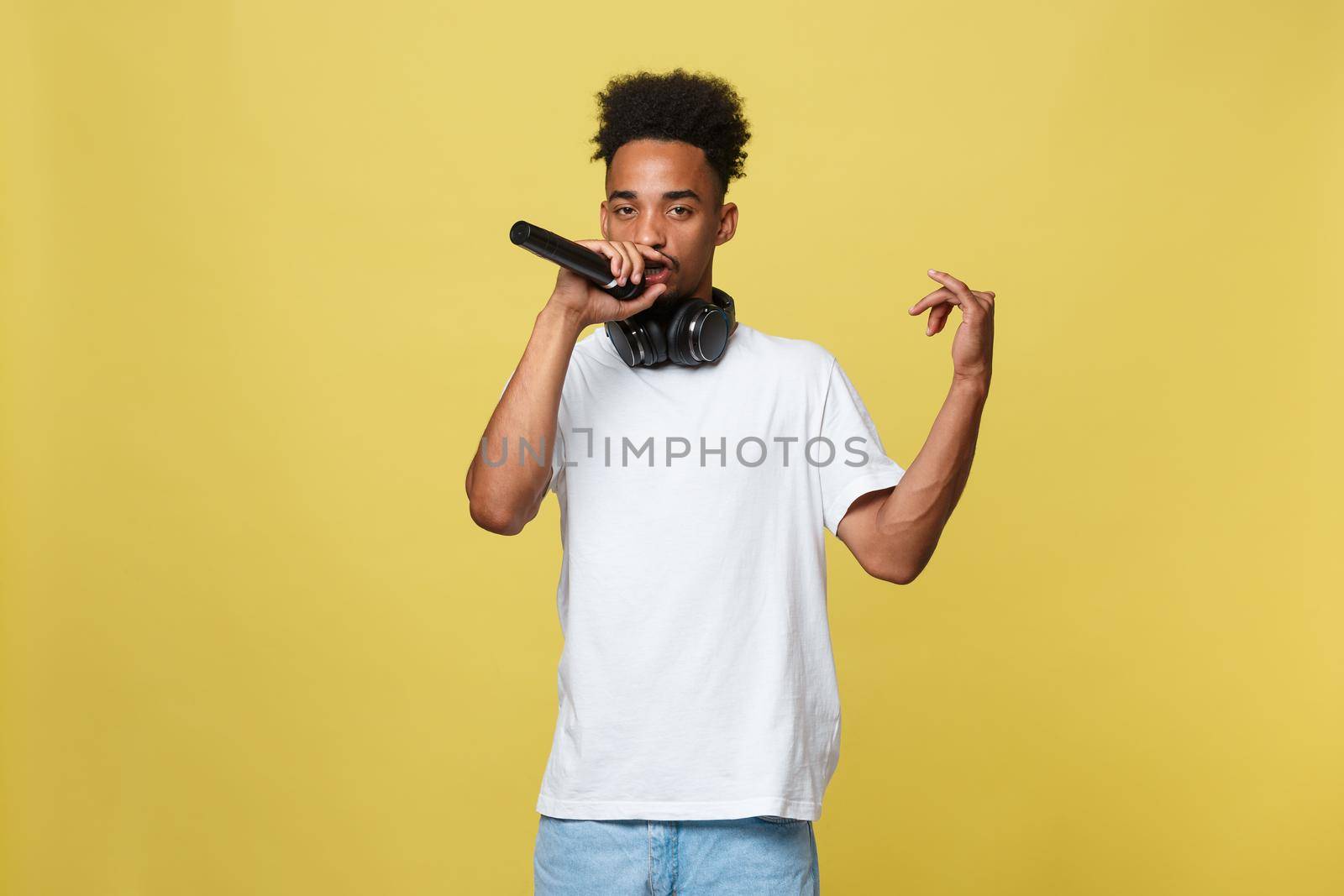 young handsome african american boy singing opera emotional with microphone. by Benzoix