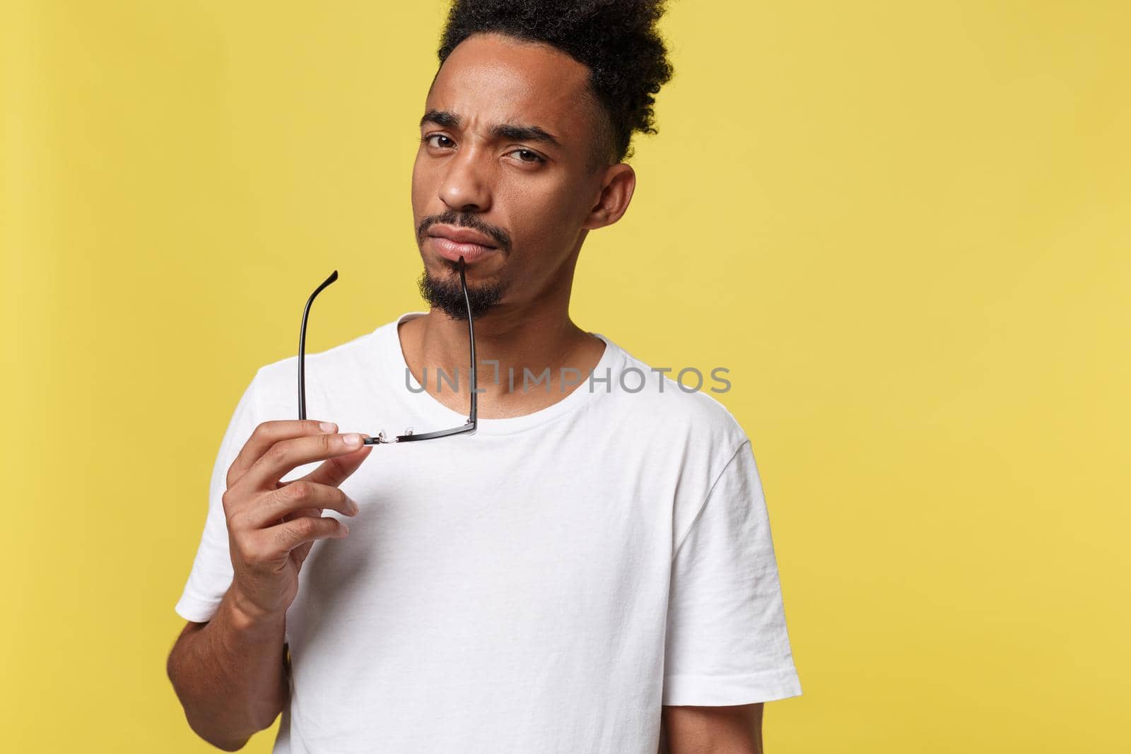 African american business man holding a glass, isolated on yellow background - Black people.